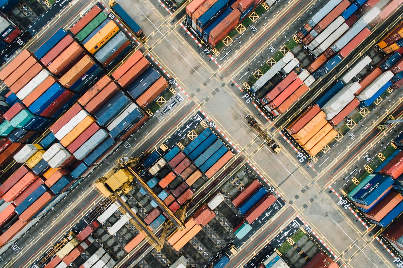 Aerial view of a container yard with stacked shipping containers